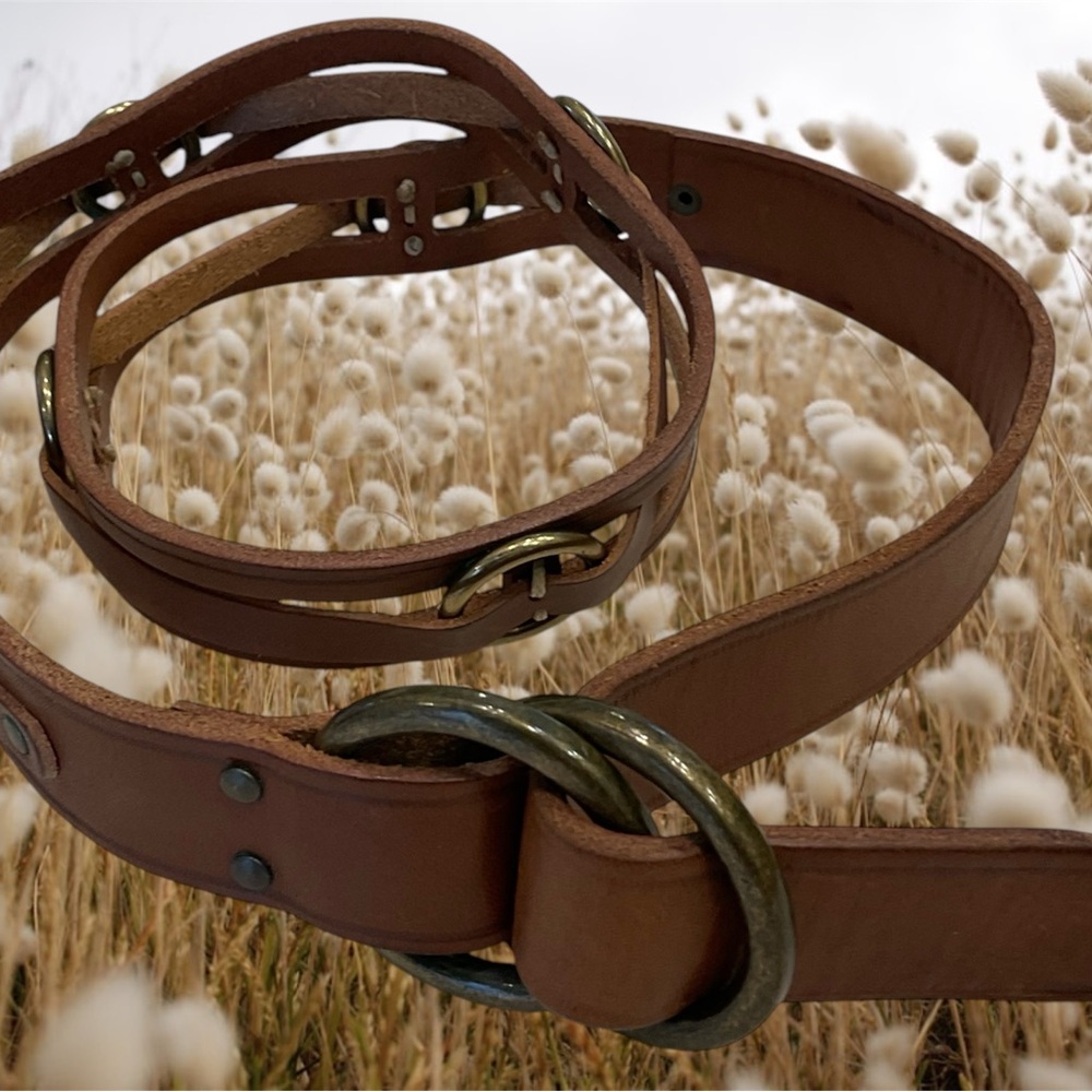 Leather belt with dark bronze buckle and circle detail, some tarnish, size small